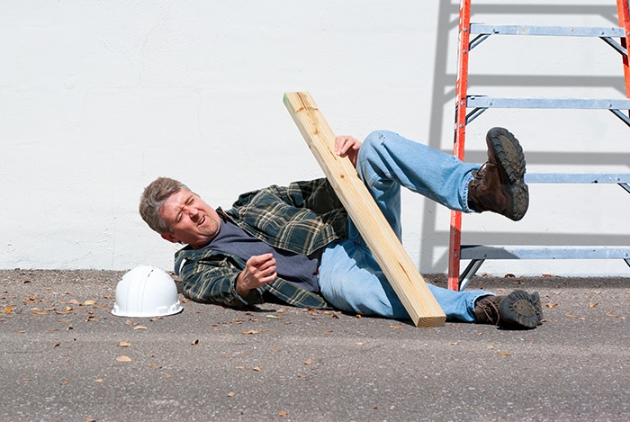 Injured construction worker fallen off ladder